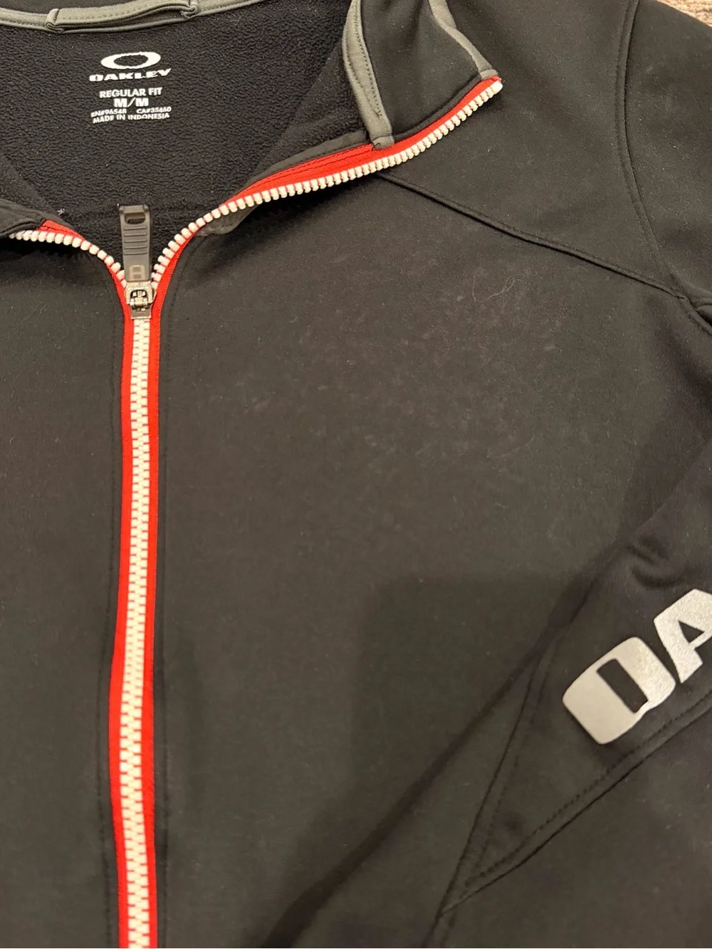 Oakley Black Jacket with Red Zip and Grey Logo